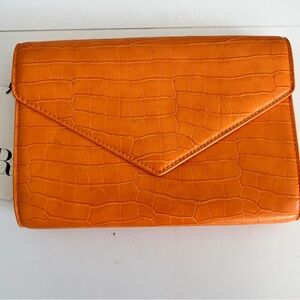 Orange croc clutch